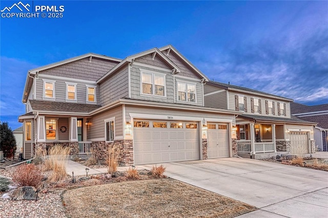 craftsman-style house featuring covered porch and a garage