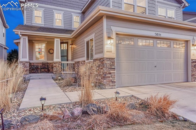 property entrance featuring a garage and covered porch