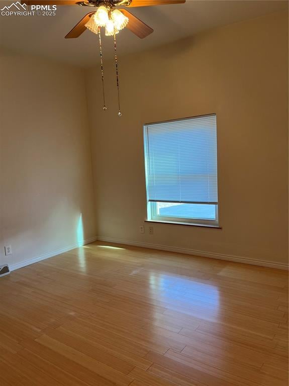 spare room featuring ceiling fan and light wood-type flooring