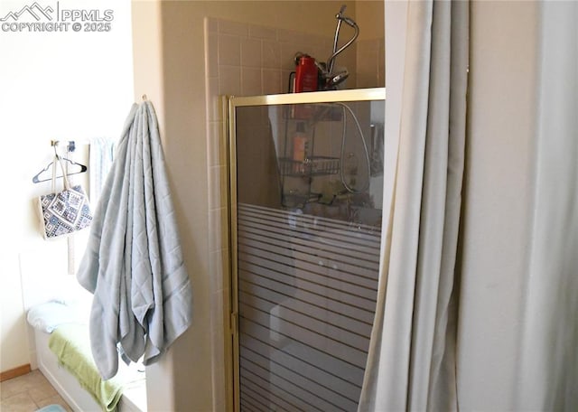 bathroom with a shower with shower door