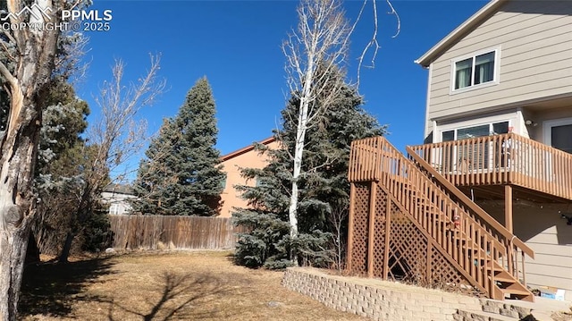 view of yard featuring a wooden deck