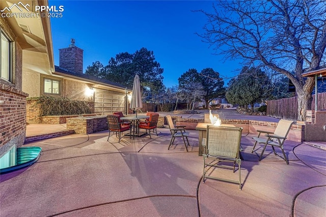 view of patio / terrace with an outdoor fire pit