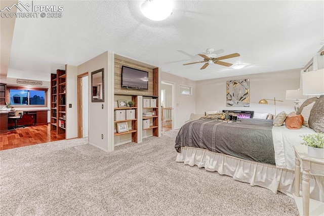 carpeted bedroom featuring a textured ceiling