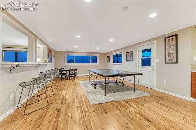 recreation room with light hardwood / wood-style floors