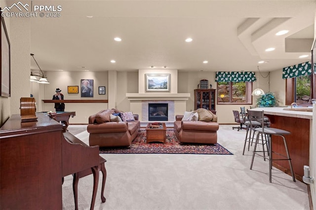 living room with pool table, baseboards, light carpet, recessed lighting, and a glass covered fireplace