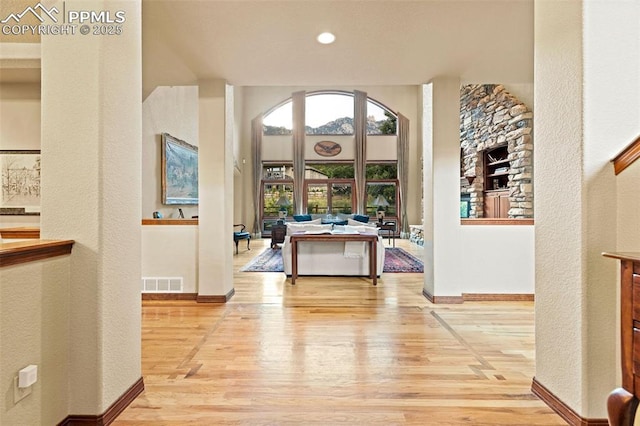 interior space with visible vents, baseboards, and light wood-style flooring