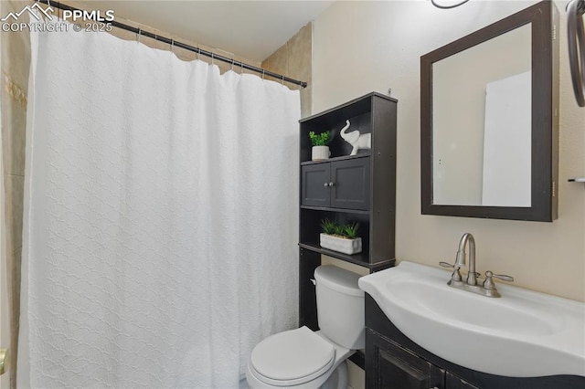full bath featuring toilet and vanity