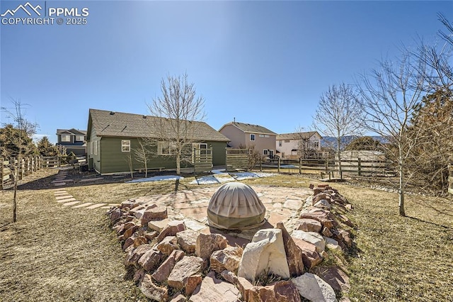 back of house featuring a patio and an outdoor fire pit