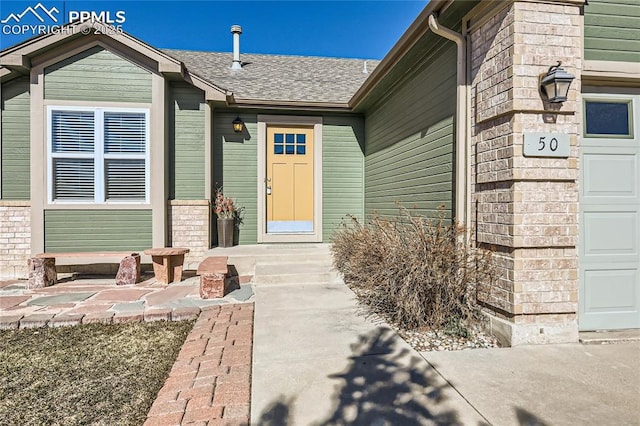 view of exterior entry featuring a garage