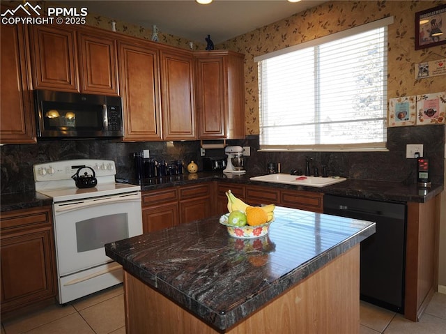 kitchen with sink, light tile patterned floors, a center island, black dishwasher, and white range with electric stovetop