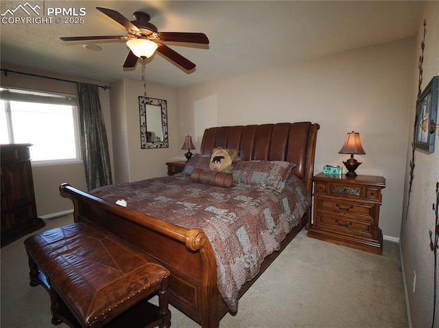 bedroom featuring ceiling fan and light colored carpet