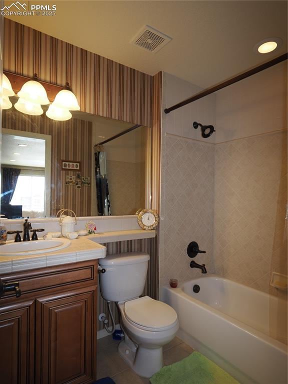 full bathroom with vanity, toilet, tile patterned floors, and shower / tub combo with curtain