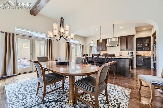 dining area featuring french doors, dark hardwood / wood-style flooring, a chandelier, and beamed ceiling