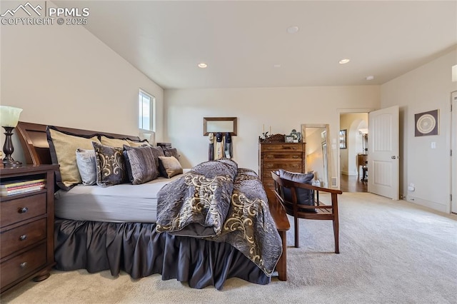 bedroom featuring light colored carpet