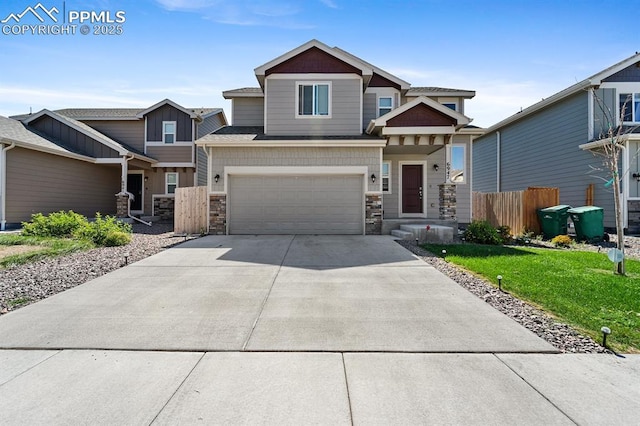 craftsman-style house featuring a garage and a front yard