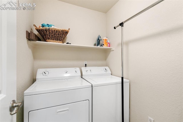 clothes washing area with washer and dryer