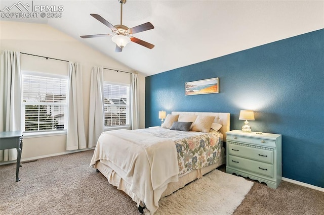 carpeted bedroom featuring lofted ceiling and ceiling fan