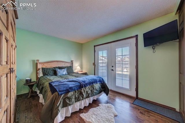 bedroom featuring dark wood-type flooring, access to outside, a textured ceiling, and french doors