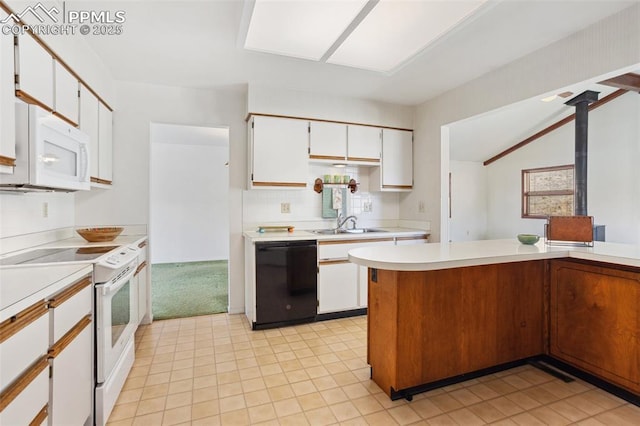 kitchen with kitchen peninsula, lofted ceiling, sink, white appliances, and white cabinets