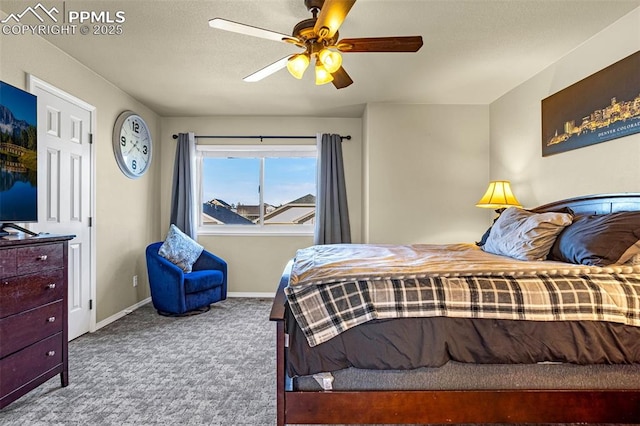 bedroom featuring ceiling fan and carpet