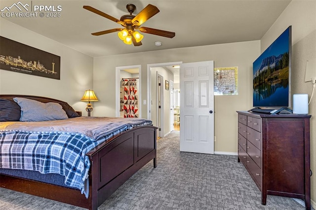 carpeted bedroom with a spacious closet and ceiling fan