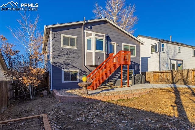 rear view of property with a patio