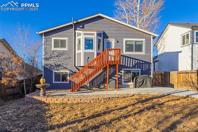 rear view of property featuring a patio area