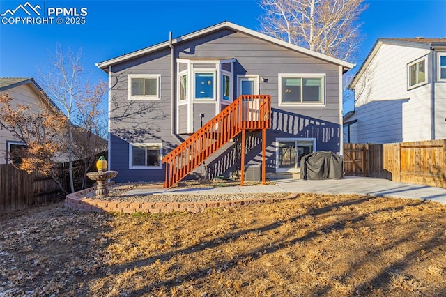 rear view of property with a patio area