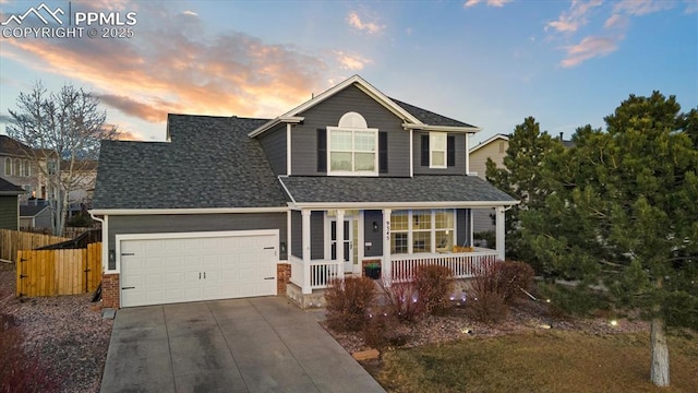 view of front of home with a garage and a porch