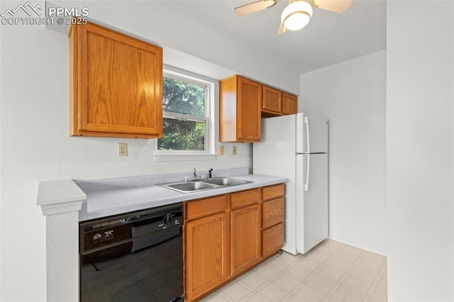 kitchen featuring light countertops, dishwasher, a sink, freestanding refrigerator, and ceiling fan