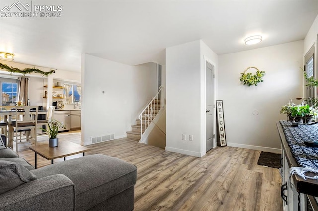 living room with light hardwood / wood-style floors