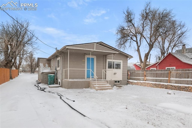 view of front of house featuring fence