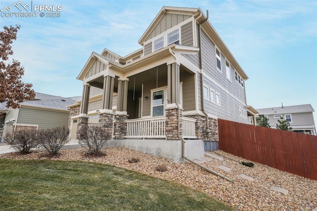 craftsman house featuring a front yard and covered porch