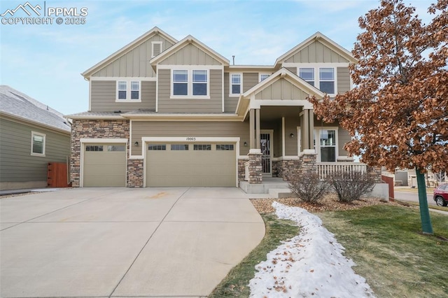 craftsman-style house featuring a porch and a garage