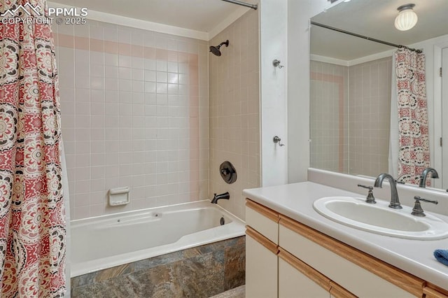 bathroom featuring shower / bath combo and vanity