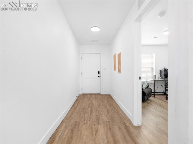 corridor featuring light wood-type flooring