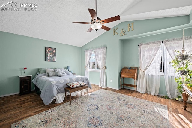 bedroom featuring ceiling fan, dark hardwood / wood-style flooring, vaulted ceiling, and a textured ceiling