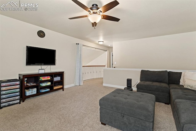 living area with a ceiling fan, carpet flooring, and baseboards