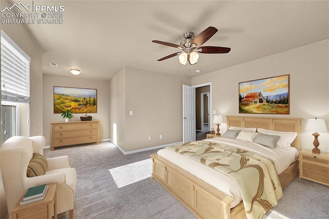 bedroom with light carpet and ceiling fan