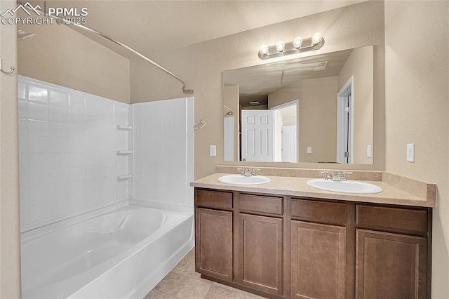 bathroom featuring vanity, tile patterned flooring, and shower / bathtub combination