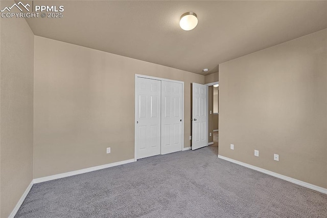 unfurnished bedroom with carpet floors and a closet