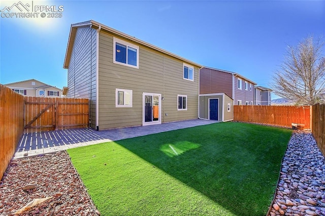 rear view of property with a patio and a lawn