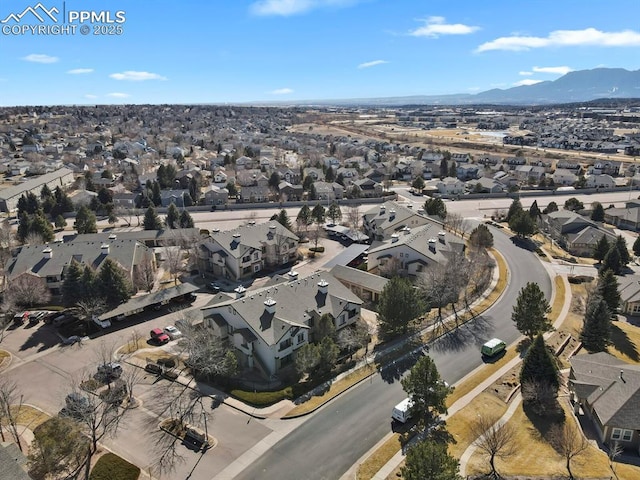 birds eye view of property with a mountain view