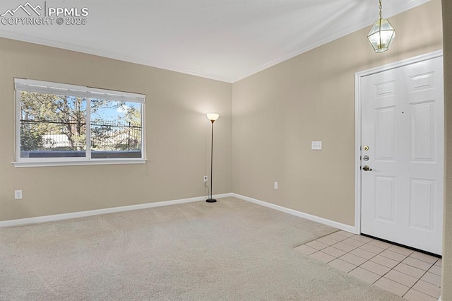 foyer entrance featuring light colored carpet and ornamental molding