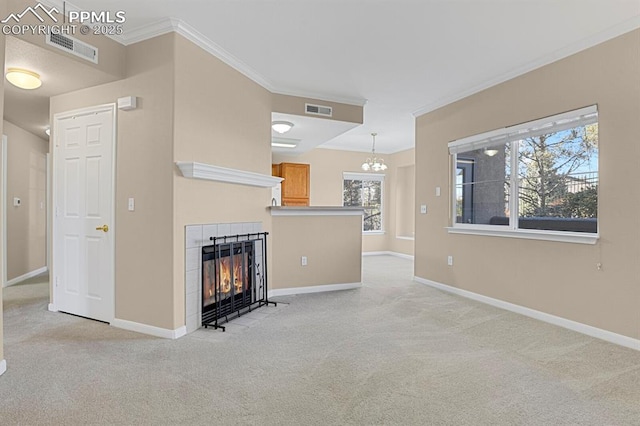 unfurnished living room with light carpet, a fireplace, ornamental molding, and a chandelier