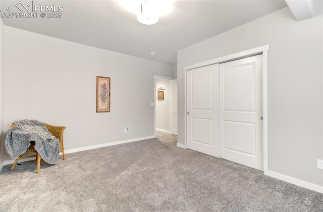 unfurnished bedroom with carpet floors and a closet