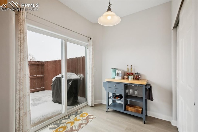 doorway to outside with hardwood / wood-style flooring