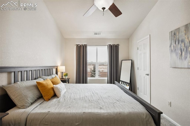 carpeted bedroom with lofted ceiling and ceiling fan