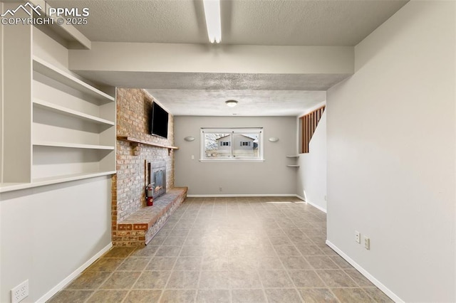 unfurnished living room with a fireplace and a textured ceiling