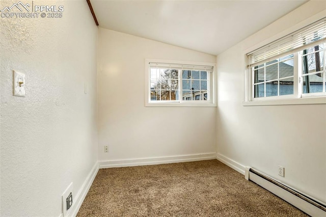 empty room featuring carpet floors, a baseboard radiator, baseboards, and lofted ceiling